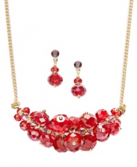 A bright pop of color. Take on the latest trend in c.A.K.e. by Ali Khan's bubbly style. Red faceted glass stones combine for a totally chic look. Set in gold tone mixed metal. Approximate length: 16 inches + 2-inch extender. Approximate drop length: 1-1/2 inches. Approximate drop width: 2 inches. Approximate earring drop: 3/4 inch.