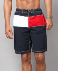 Show your true colors. These Tommy Hilfiger swim trunks are all-American cool.