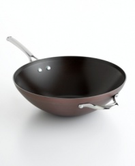 Just right. The perfect kitchen companion, this elegant bronze piece features multiple layers of nonstick technology, a hard-anodized construction and stay-cool handles for an unrivaled combination of professional performance and everyday ease. Your go-to with professional high sides ideal for whipping up exquisite Chinese and Thai food, like stir fry and rice. Lifetime warranty.