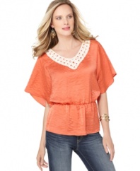 A touch of crocheted trim at the neckline gives this petite AGB top classic appeal, while the flutter sleeves and blouson-style fit make it modern (and quite a match with denim!). (Clearance)