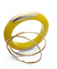 Sunny with a shot of gold. Bar III's chunky yellow acrylic bracelet gets a dose of shine with a gold tone accent and two complementary skinny gold tone mixed metal bangles. Approximate diameter: 2-5/8 inches.
