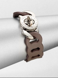 An unique design that features supple leather in a link chain motif with a logo engraved turnlock closure. LeatherRhodium-plated brassLength, about 7.6Turnlock closureImported 