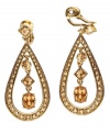 These gorgeous teardrop clip-on earrings by Monet are a unique way to add desirable sparkle to your special look. Crafted in crystal accents and goldtone mixed metal. Approximate drop: 1-1/2 inches.