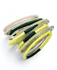 Wrapped, beaded, and ready to go! Bar III's layered 15 bangle set adds instant dimension with wrapped lime  and dark green fabric, mixed with cream and light green beads. Set in silver tone mixed metal. Approximate diameter: 2-1/2 inches.
