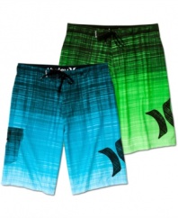 Dive into style and comfort from the beach to the boardwalk with these graphic board shorts from Hurley.