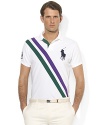 Designed exclusively for Ralph Lauren's collection celebrating the Wimbledon Championships, a classic short-sleeved polo shirt is tailored for a trim, athletic fit from breathable cotton mesh with preppy diagonal sash stripes.