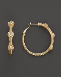 18K gold hoops sparkle with round diamond pave stations. By Judith Ripka.