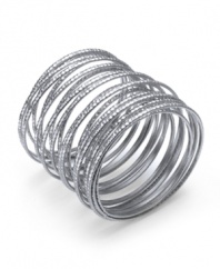 Layer up all at once! Bar III's unique bracelet combines multiple rows of textured silver tone mixed metal into one fabulous style. Approximate diameter: 2-1/2 inches to 2-3/4 inches.