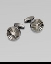 Concentric links of gunmetal-plated metal are polished on the outside and sandblasted in the recessed ridges to enhance the pattern. Gunmetal-plated metal About ½ diam. Made in the United Kingdom 