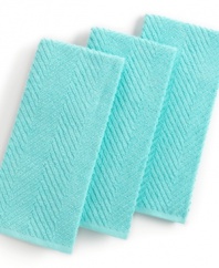 Grab style and keep function with a set of three kitchen towels that step forward in an eye-catching color to wipe up spills, aid in prep and add an accent to your space. The textured design sets a sharp appearance for any room, while the highly absorbent terry quickly cleans up. Limited lifetime warranty.