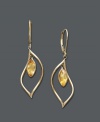 An easy splash of sunshine. Earrings feature bezel-set citrine drops (1-5/8 ct. t.w.) crafted in a dainty 14k gold hoop setting. Approximate drop: 1-1/2 inches.