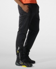 Designed for high-level comfort and superior performance, an athletic track pant is crafted in sleek stretch microfiber with hydro-mesh panels and reflective graphics.