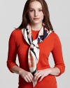 A ladylike sun and floral print scarf with a springtime feel. By Salvatore Ferragamo.