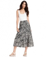 Style&co.'s skirt effortlessly balances elements that are daring and feminine, mixing animal and lace prints on a tiered A-line silhouette. Tuck in a tank and your outfit is complete!