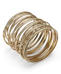 Layer up all at once! Bar III's unique bracelet combines multiple rows of textured gold tone mixed metal into one fabulous style. Approximate diameter: 2-1/2 inches to 2-3/4 inches.