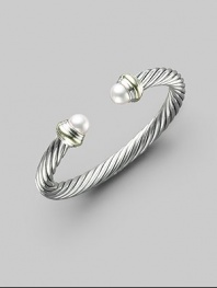 From the Cable Classics Collection. A signature Yurman cable of sterling silver, with lustrous white freshwater pearl end caps banded in 14k gold. White freshwater pearls Sterling silver and 14k yellow gold Cable, 7mm Diameter, about 2¼ Imported