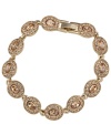 A vintage delight. Luminous, oval and round-shaped glass accents shine on Carolee's topaz-hued flex bracelet. Set in 12k gold-plated mixed metal. Approximate length: 7 inches.