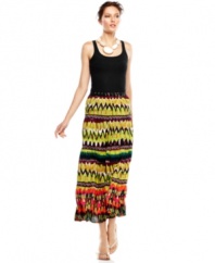 A bold global-inspired print puts this Calvin Klein maxi skirt center stage for standout summer style!