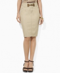 An elegant pencil skirt silhouette is crafted in neutral denim and finished with a heritage faux-suede buckle at the front.