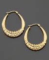 Complement your everyday look with these gorgeous engraved hoop earrings crafted in 14k gold. Approximate diameter: 3/4 inch.