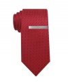 A silver tie bar adds subtle sophistication to this solid Alfani skinny tie.