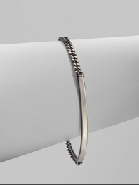A chic, curved bar on a narrow link chain accented with a logo charm for a sleek design. Ruthenium-plated brassLength, about 7Lobster clasp closureMade in Italy