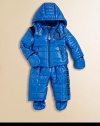 Quilted puffer design makes this snowsuit perfect for everything from snowball fights to beginner ski lessons. Stand collar with double snap closure and zip-out hood Front zip closure Dual zip pockets Removable mittens and footies attached with snap closures Pants have changeable suspender straps with snap closures Pants have an elastic waist Polyester Nylon lining Machine wash Imported