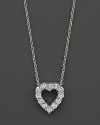 From the Tiny Treasures collection, a baby heart diamond necklace; with signature ruby accent. Designed by Roberto Coin.