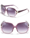 Glamorous oversized square sunglasses with large circular logo detail along open temples.