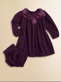 Plush, long-sleeve style with a smocked neckline and pretty flowers for an extra special touch. Round neckSmocked necklineLong sleeves with elastic cuffsButton back92% polyester/8% spandexHand wash or dry cleanImported