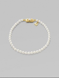 A strand of white cultured pearls with signature clasp closure.4mm white cultured pearls 18K yellow gold Length, about 7 Minuette clasp closure Imported 