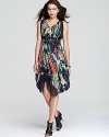 Ultra-chic for beach getaways and cocktail hour alike, this Nicole Miller dress boasts a painterly floral print for artistic flair.