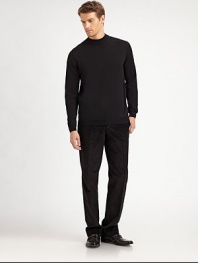 A sophisticated layer with a ribbed mockneck collar in soft merino wool.Ribbed mockneck collarLong sleeves with ribbed cuffsRibbed hemMerino woolDry cleanImported