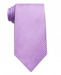 Adding some visual depth to a monochromatic tie, this printed pattern easily complements a solid tailored shirt.