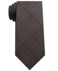 In a cool, muted plaid, this Bar III skinny tie proves style doesn't have to shout to be heard.