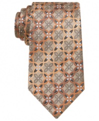 Punch up your wardrobe of solid dress shirts with this medallion-patterned tie from Alfani.