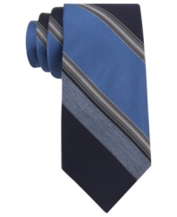 With a cool palette of colors, this Calvin Klein striped skinny tie makes a solid statement.