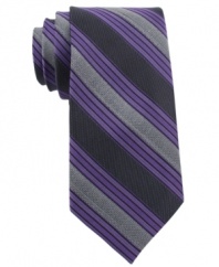 In a traditional stripe pattern, this Calvin Klein skinny tie recalls classic haberdashery style.
