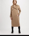 Modernized by an asymmetrical zipper, this military-inspired trenchcoat has notched lapels, slash pockets and a back vent for mobility. Notched lapelsButton frontAsymmetrical zipperLong sleeves with buttoned cuffsSlash pocketsButtoned back belt; back ventAbout 36 from shoulder to hemCottonDry cleanMade in ItalyModel shown is 5'10 (177cm) wearing US size 2.