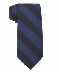 Bold bar stripes make a solitary statement on this skinny tie from Tommy Hilfiger.