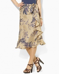 Hand-painted with a large floral pattern, the flowing silk Ludine skirt is crafted in a ruffled sarong silhouette.
