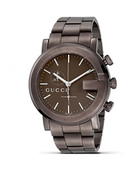 A brown bracelet watch from the Gucci G Chrono collection. Round guilloché G dial in brown casing. Stick hour indices, sweep second hand.