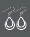 Polish your look in shapely style. These chic, Unwritten earrings feature a graduated, cut-out teardrop design in sterling silver. Approximate drop: 1-1/2 inches.
