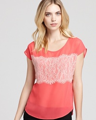 A pretty lace applique at the front of this Aqua top masters coquettish summer style. For a cute pairing, partner the feminine piece with your favorite love-worn jeans.