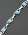 Elegant and refreshing, this bracelet melds luminous sterling silver with larimar. Measures approximately 8 inches long.