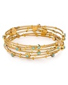The Seasonal Whispers girl loves to stack the brand's beautifully eclectic bracelets. This set is studded with turquoise colored Swarovski crystals and gold inserts, creating a cool textured statement.