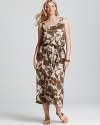 Camouflage goes chic as this MICHAEL Michael Kors Plus maxi dress plays up a natural color palette with an oversized floral print. Garnish with gold accents for 24-7 style.