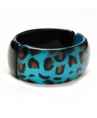 Fierce fashion. Show the world your wild side in this chic, animal print bangle by Haskell. Crafted in teal-colored mixed metal. Hinged design slips easily over the wrist. Approximate length: 8 inches.