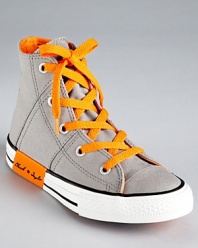 Criss cross topstitching and clever contrast accents update Converse' classic high top sneaker for the 21st century.