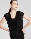 Master city sophistication in this Eileen Fisher top, touting a draped neckline and a mesh back for an alluring silhouette. Keep the look modern and style with sleek, minimalist staples.